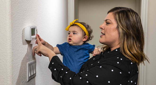 Woman and Child turn on lights